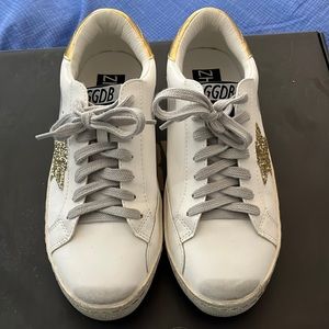GGDB inspired distressed, gold star sneakers.